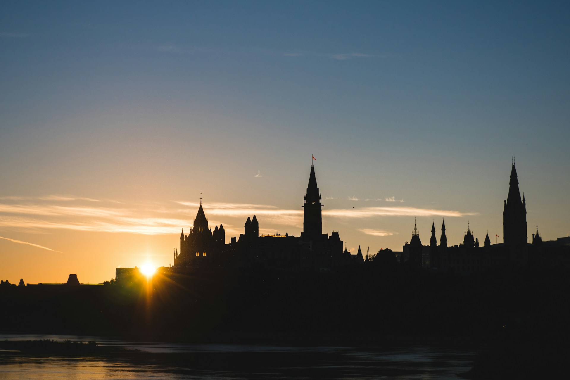 Silhouette of Parliament Hill in Ottawa at sunset, representing the Supreme Court of Canada's landmark decision in Democracy Watch v. Canada (Attorney General) and the limits of privative clauses.